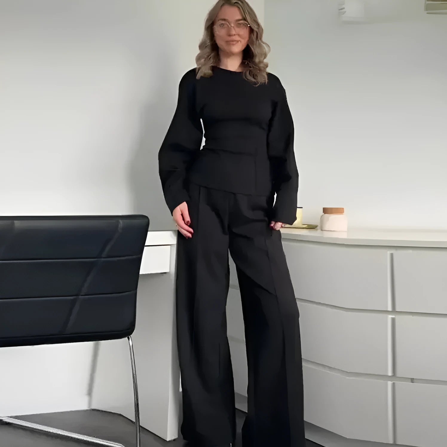 Women's apricot colour polar fleece lounge suit featuring a long sleeve pleated top and wide-leg trousers.