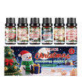 Christmas aromatherapy oil set showing 60ml bottle and six 10ml mini bottles with reed diffuser sticks