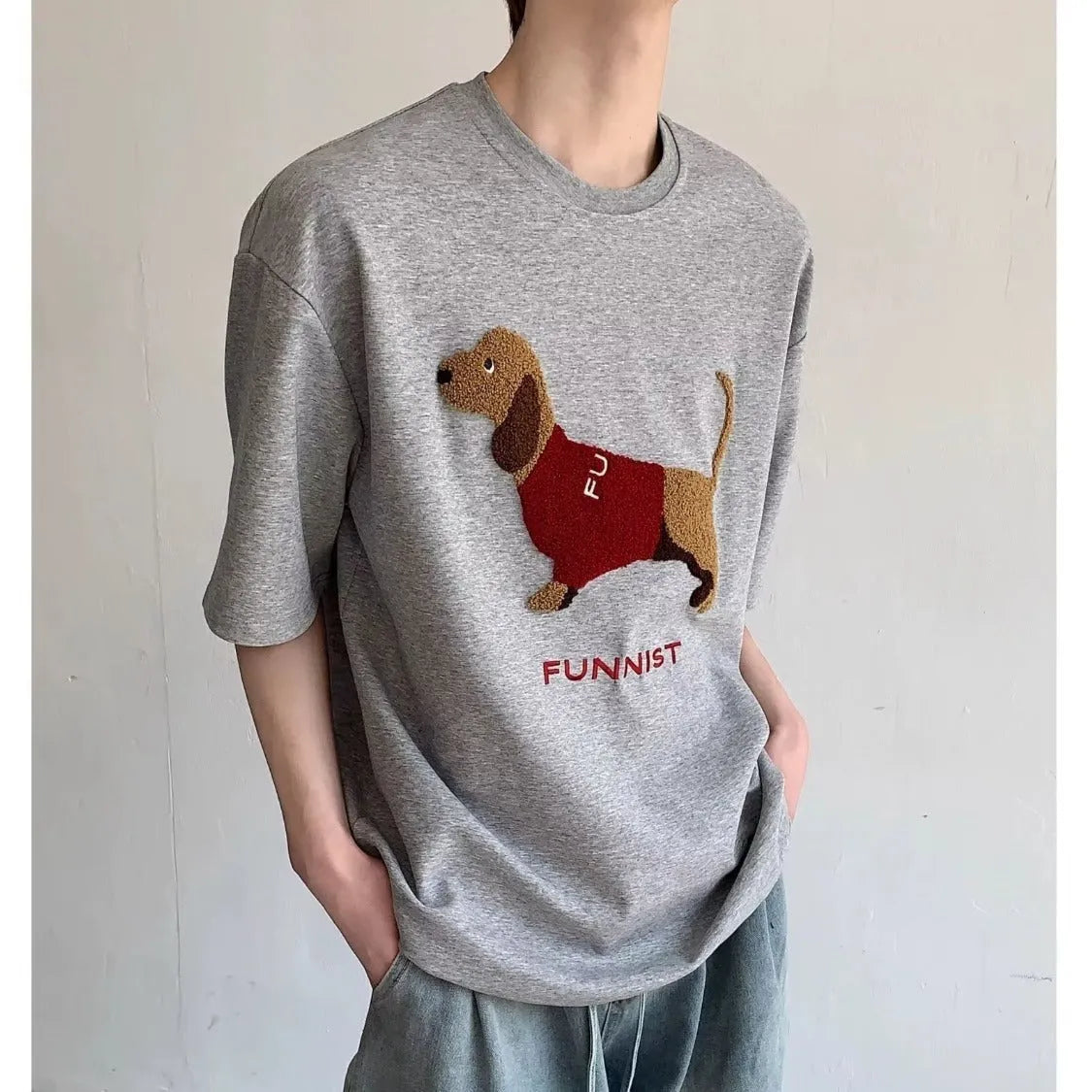 Men's grey t-shirt with embroidered sausage dog design on chest, round neck, short sleeves.