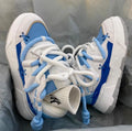 Women's grey retro chunky high-top sneakers with thick rubber platform sole and lace-up front.
