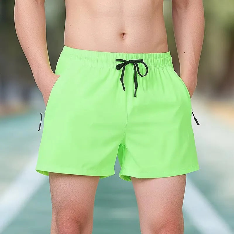 Man wearing black high-waist polyester fitness training shorts with a drawstring waist.