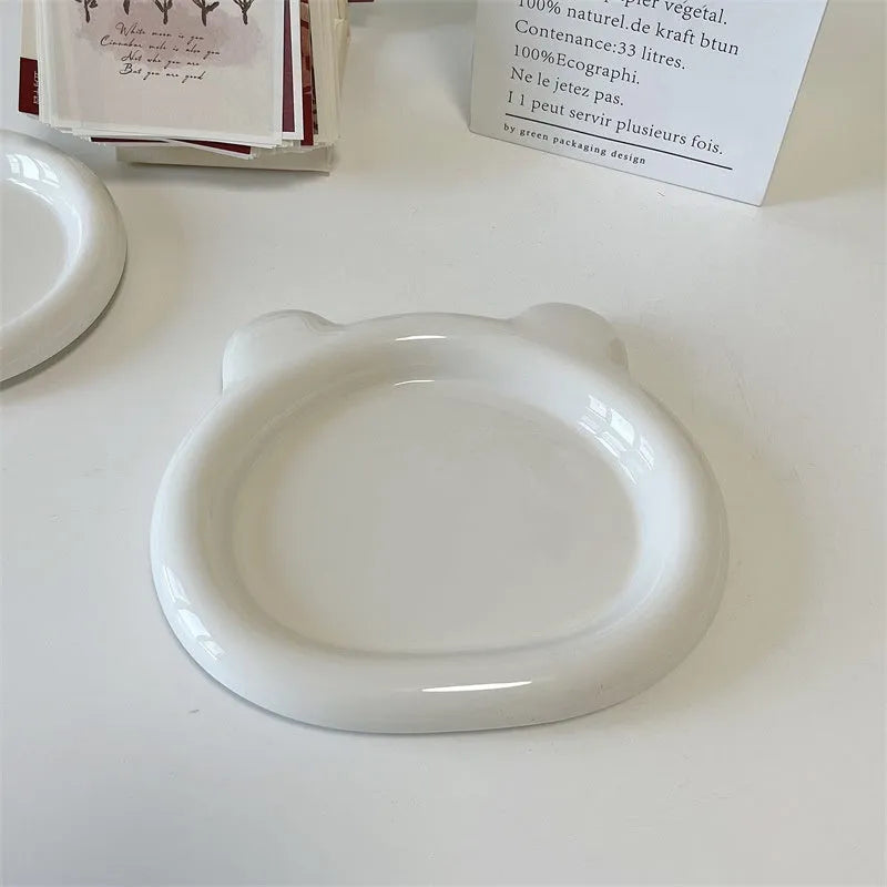 White porcelain plate with bear doodle or round doodle design, shown in 15cm and 20cm sizes.