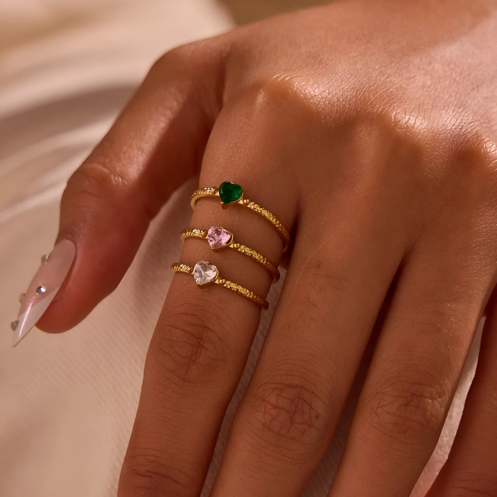 Open ended stainless steel ring with heart-shaped zirconium inlay in white, pink or green