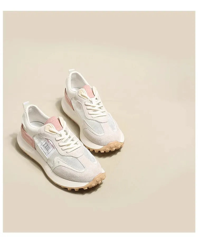 Women's grey retro sneaker with low-top design, mesh lining, and rubber sole