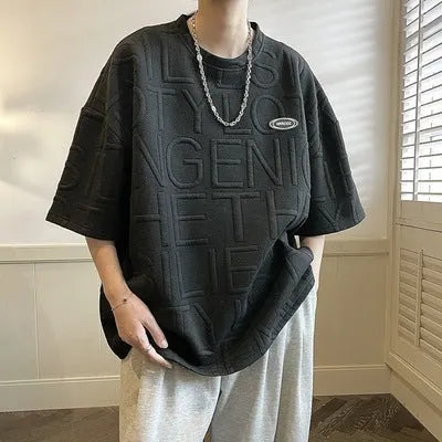 Men's grey t-shirt with raised three-dimensional letter pattern on chest, short sleeve loose fit