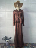Dark brown long sleeve dress with floral pattern, button details, and a retro fake two-piece style.
