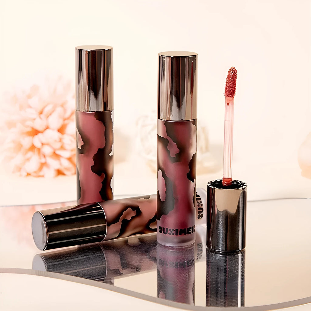 Matte lip mud lipstick tube showing five colour shades including orange brown coffee and cool grey