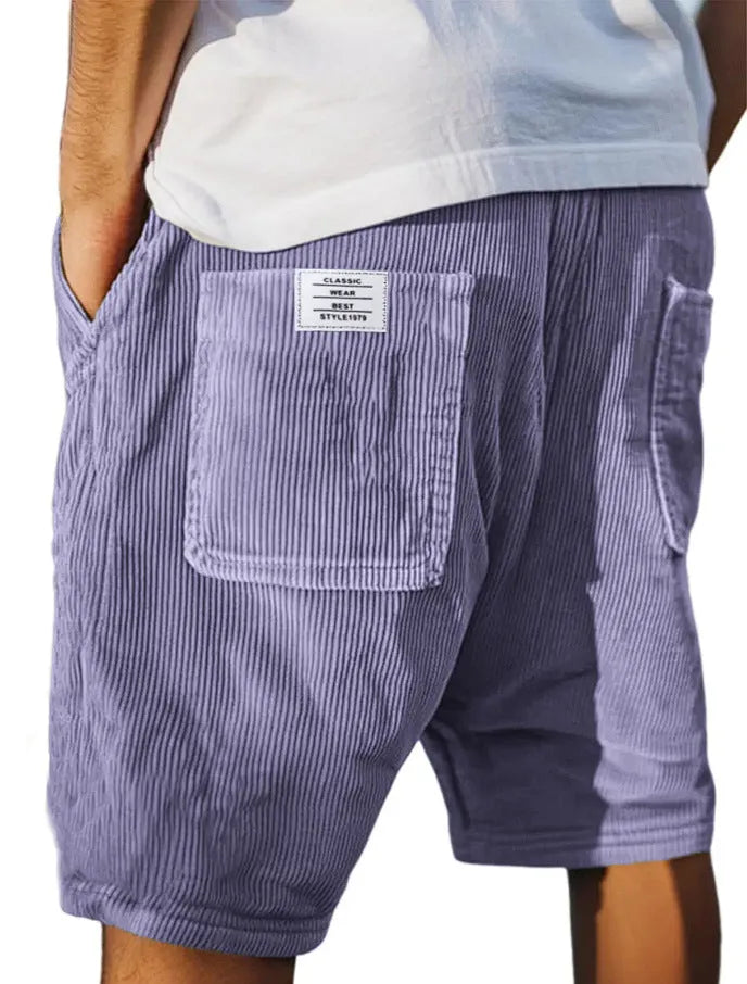 Men's grey corduroy shorts with multiple pockets and embroidery detail on leg, laid flat.