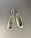 Two-tone geometric marble pattern drop earrings in alloy metal showing contrasting colours