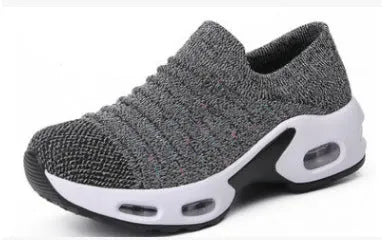 Women's plus size fly-knit socks shoes in dark blue with mesh upper and low heel, showing round toe design.