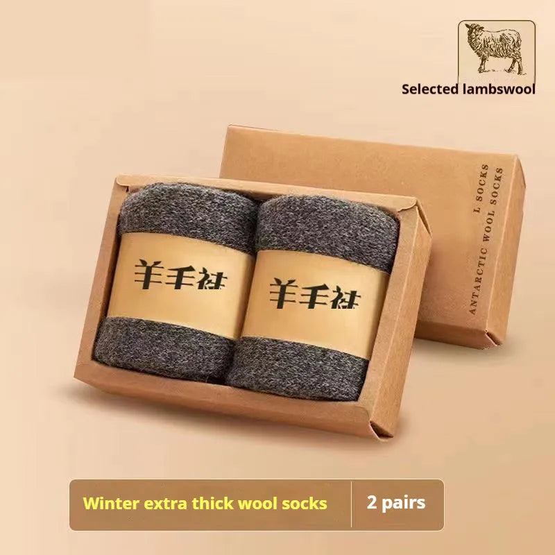 Pair of thick solid-colour wool socks with a merino midsole, shown with a storage box.