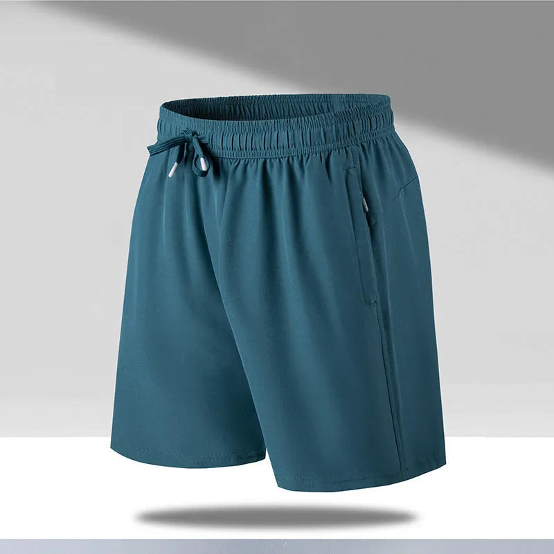Man wearing loose black quick-dry sports shorts with an elastic waistband