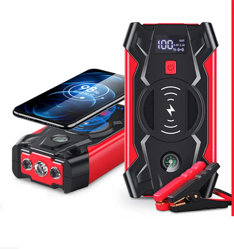 Red car emergency jump starter power pack showing digital display and battery clips