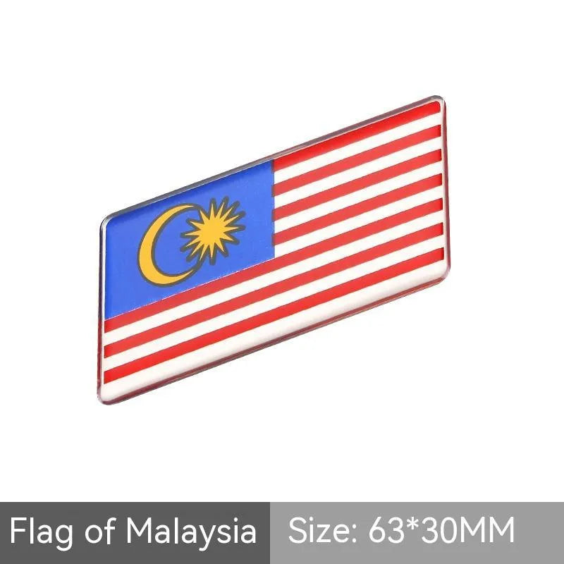 Aluminium metal car sticker with national flag design in a parallelogram shape.