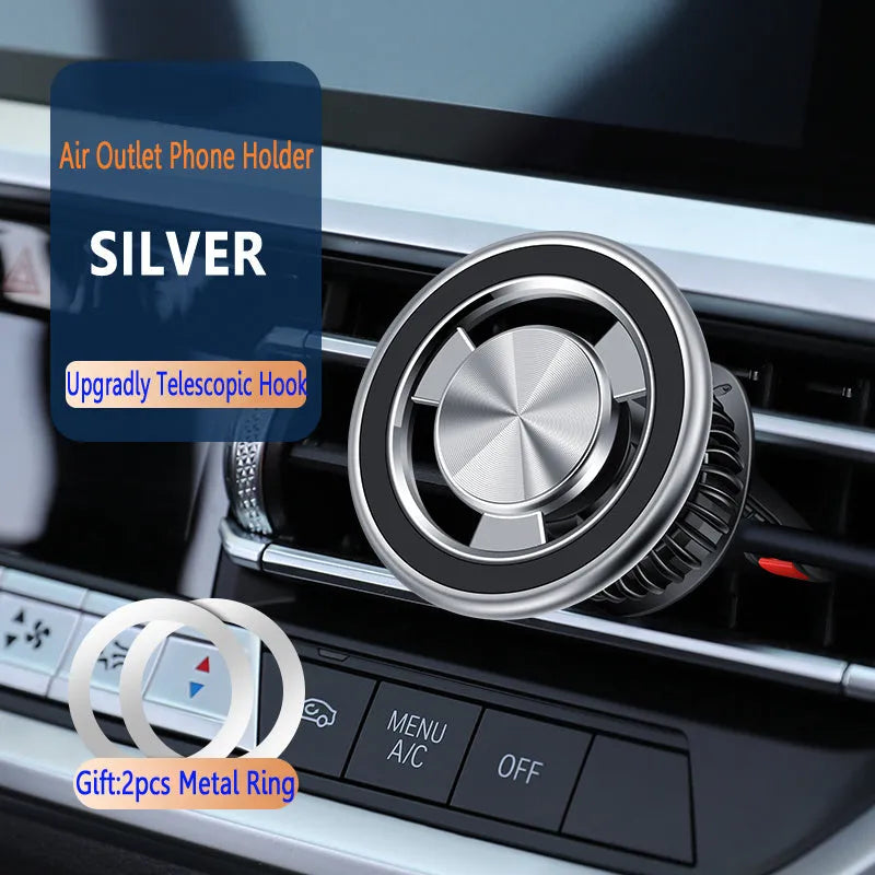 Silver and black magnetic car phone holder mounted on a vehicle air vent