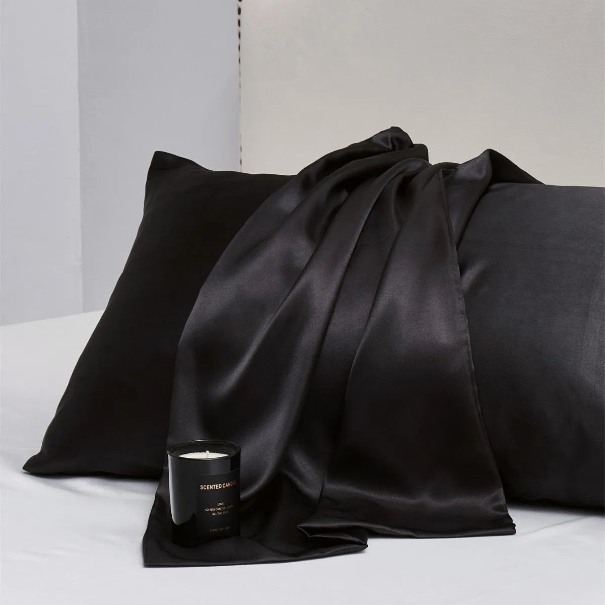 Pair of solid colour satin cloth pillowcases in polyester fibre available in twelve colours and four sizes