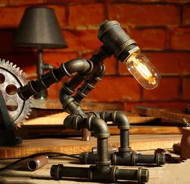 Vintage industrial robot table lamp with iron pipe design and water pipe light filtering