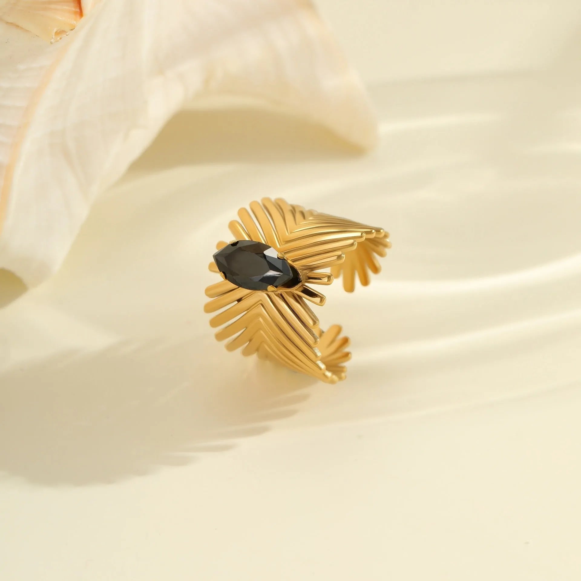 Geometric stainless steel ring for women with zircon detail and open adjustable design.