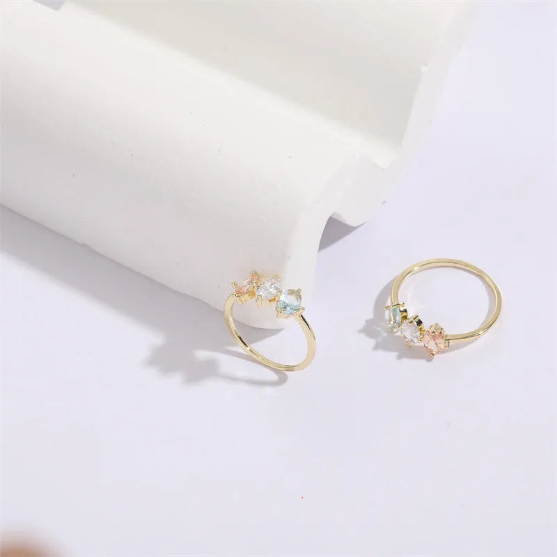 Geometric triangle birthstone ring with horse eye tricolor zircon stones in gold finish
