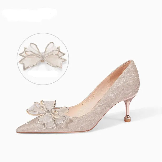 Women's champagne gold stiletto high heels covered in crystal sequins with a pointed toe.
