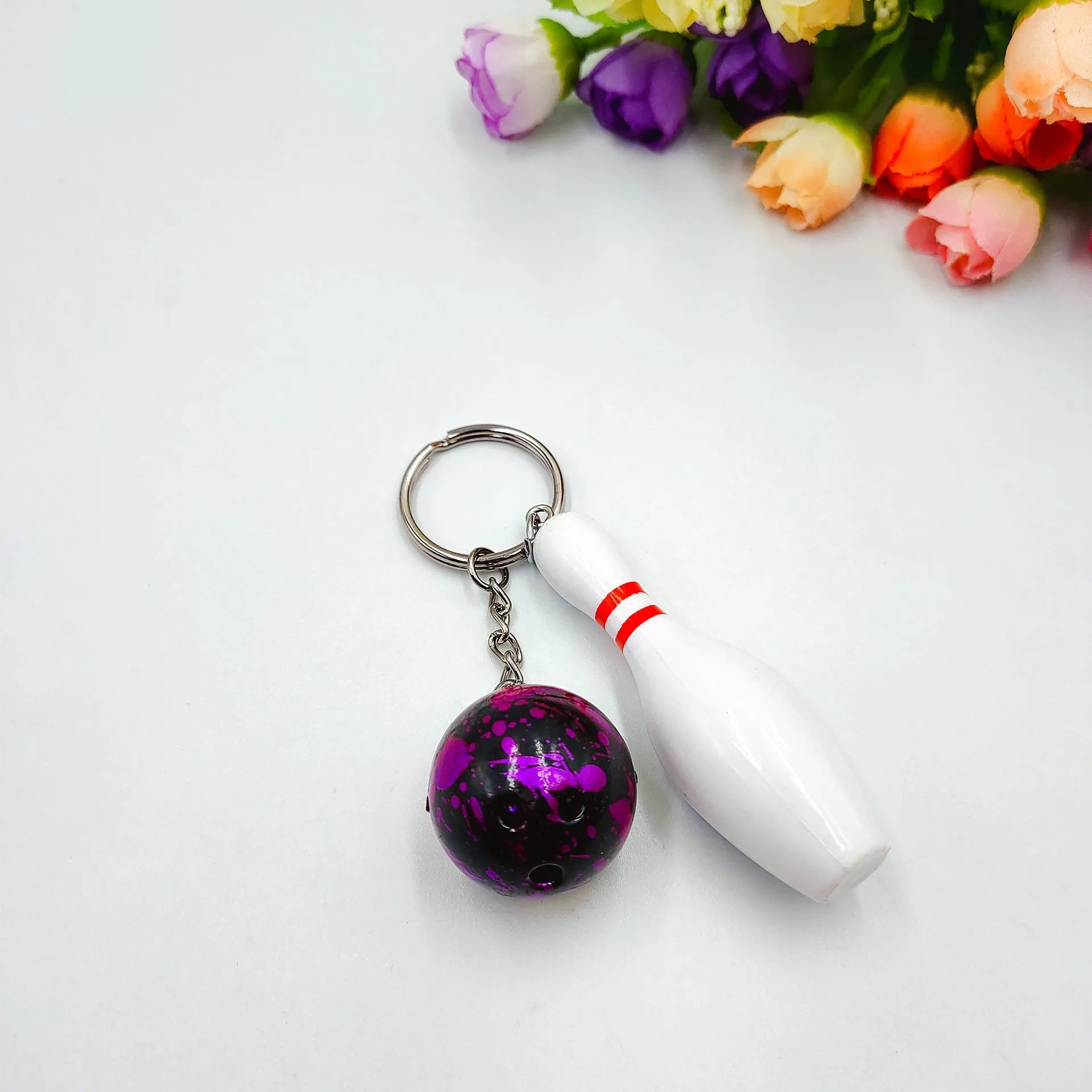 Mini simulation sports bowling keychain pendant in PVC metal on a key ring.