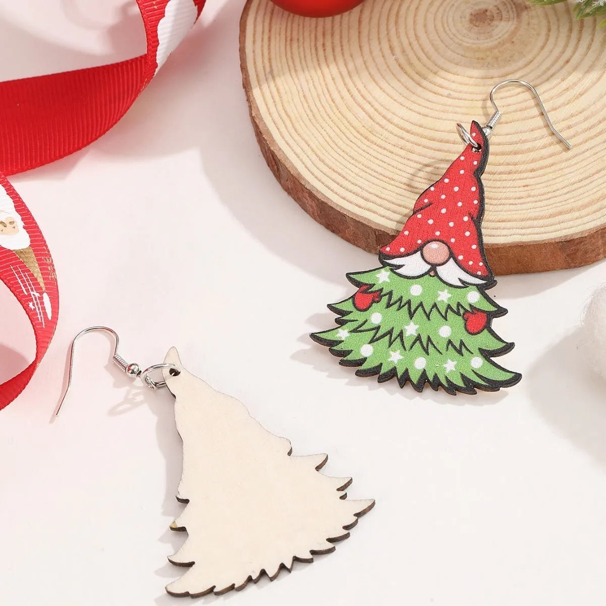 Women's wooden Christmas earrings with geometric tree and snowman shapes featuring Santa Claus elements