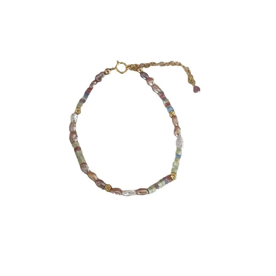 Natural pearl bracelet and necklace set with purple silver beads and 14K gilded accents in irregular U-shaped design