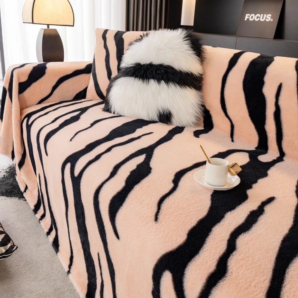 Zebra pattern non-slip flannel sofa cover with matching pillowcase in caramel colour.