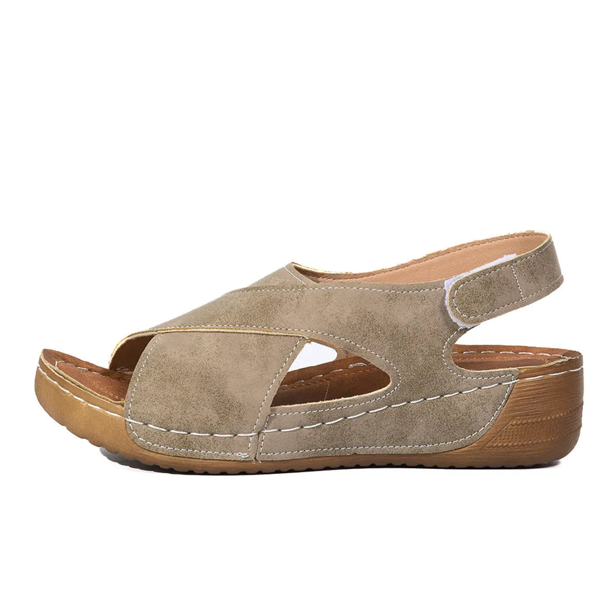 Women's brown platform Roman sandals with skirted ankle strap and Velcro fastening on a white background.