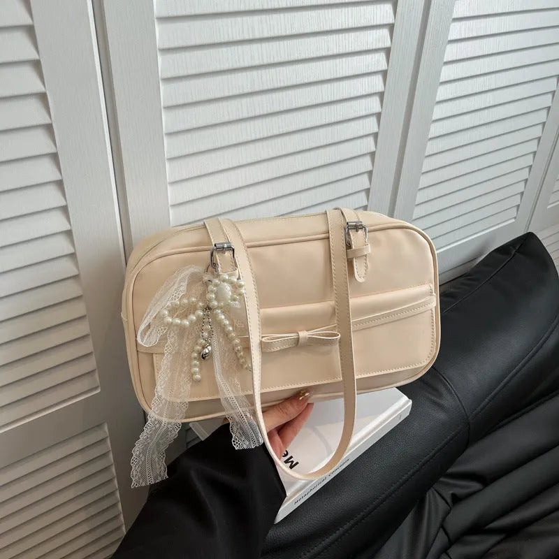 Women's black PU leather single-shoulder flap bag with a phone pocket and double-joint straps.