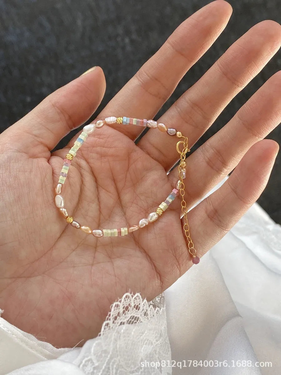 Natural pearl bracelet and necklace set with purple silver beads and 14K gilded accents in irregular U-shaped design