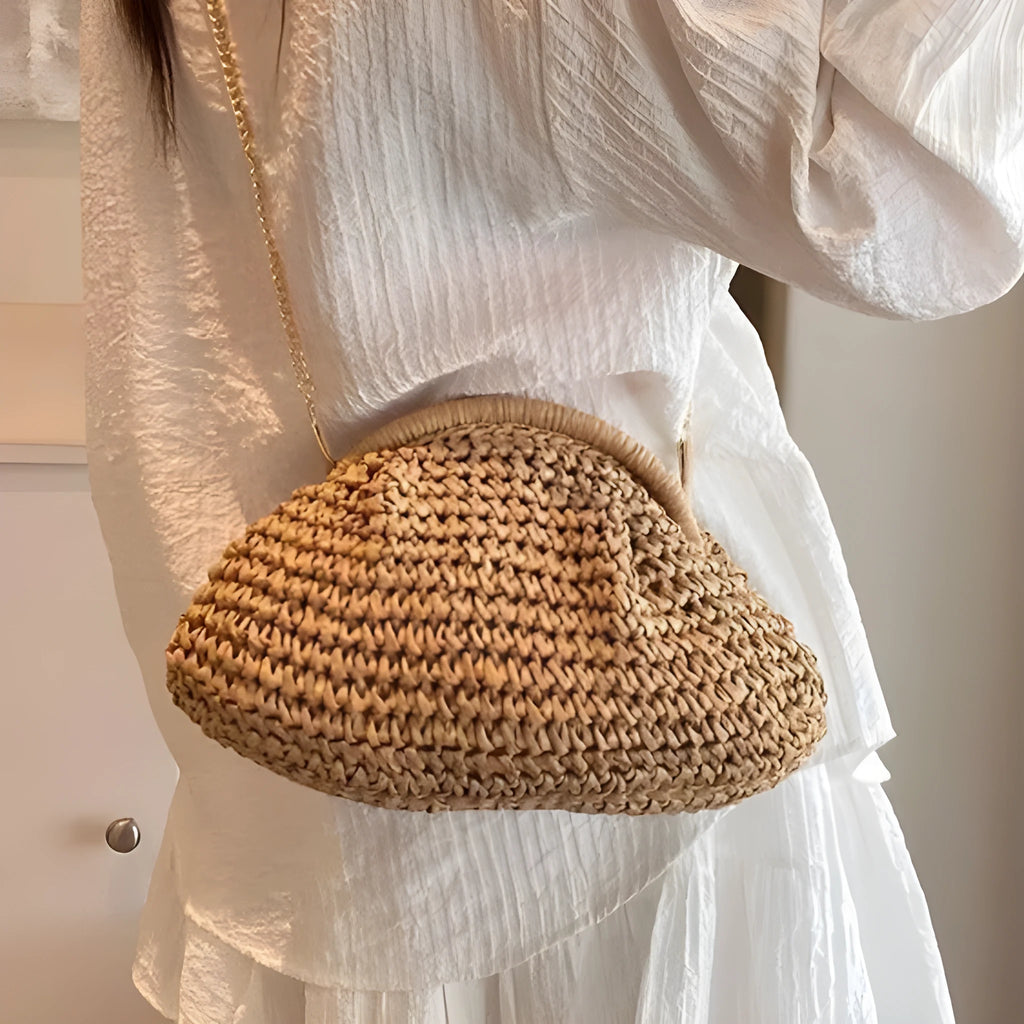 Shell-shaped women's straw bag with chain strap in khaki colour option showing zippered pocket detail