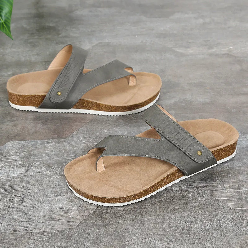 Flat toe ring thick-soled flip-flops in a solid colour on a light background