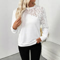 White women's long sleeve top with floral pattern, loose fit pullover style