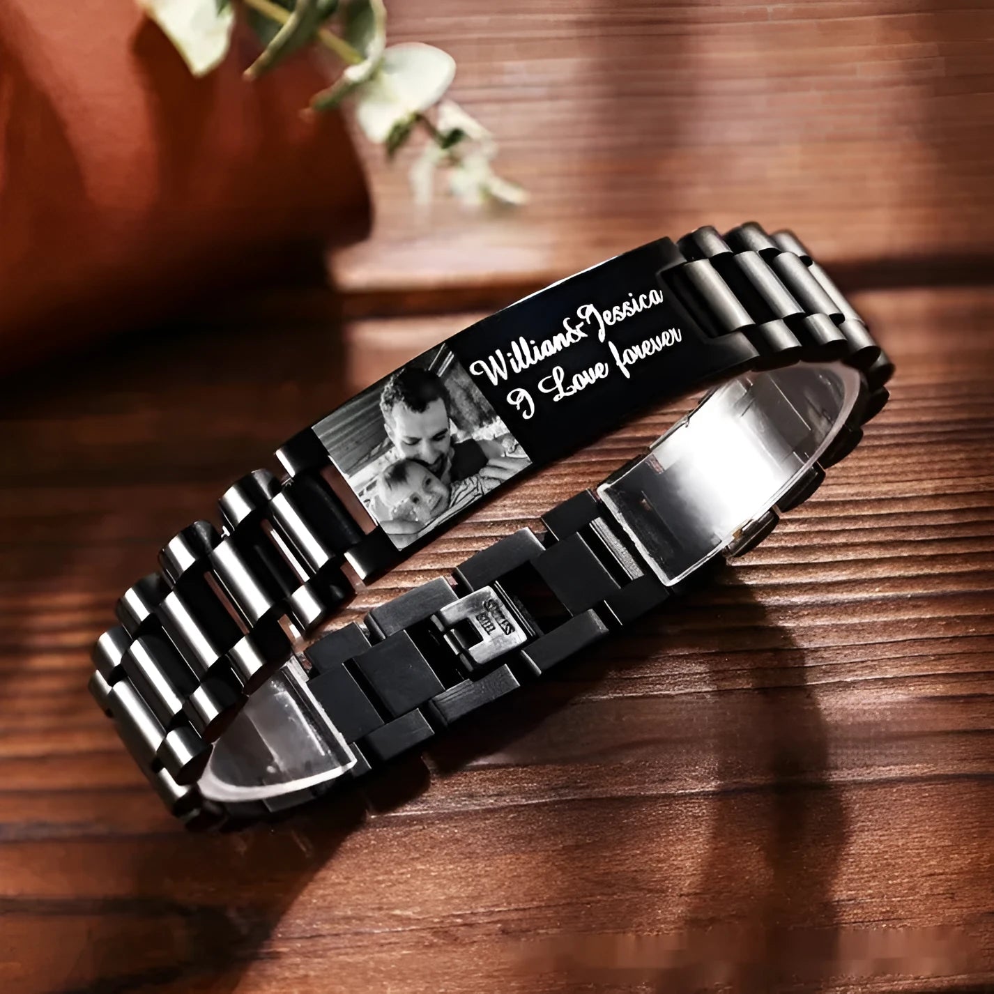 Men's stainless steel heart-shaped bracelet with engraved lettering options on wrist