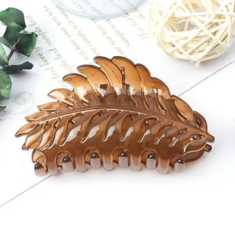 Frosted leaf hairpin side clip with rainbow detail in black colour