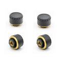 Four black Bluetooth tyre pressure sensors for mobile app monitoring system