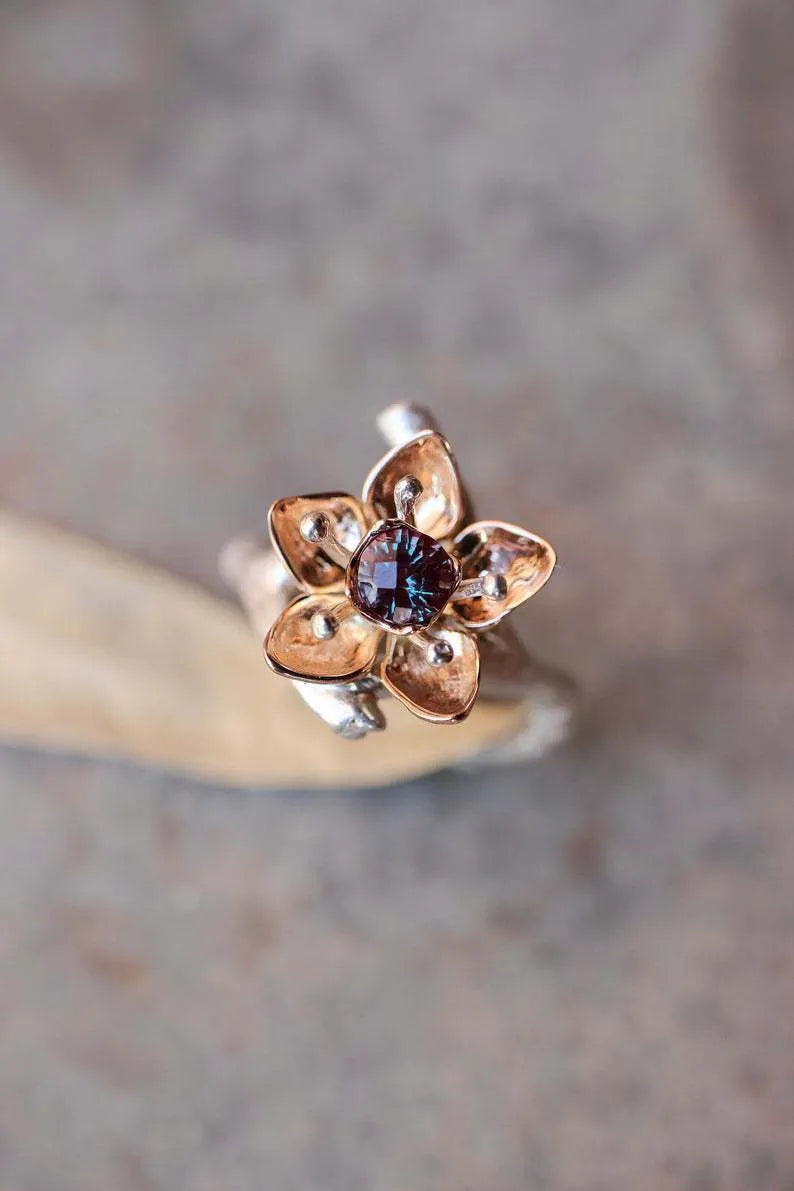 Silver two-tone women's ring with geometric shapes and floral design elements on alloy metal