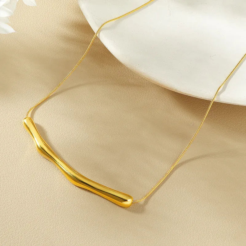 Women's titanium steel necklace with a textured irregular pleated design, shown in gold and steel colour options.