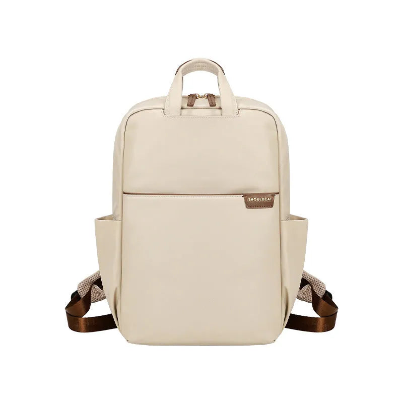 Simple canvas women's travel backpack in apricot colour with multiple compartments and sandwich pocket