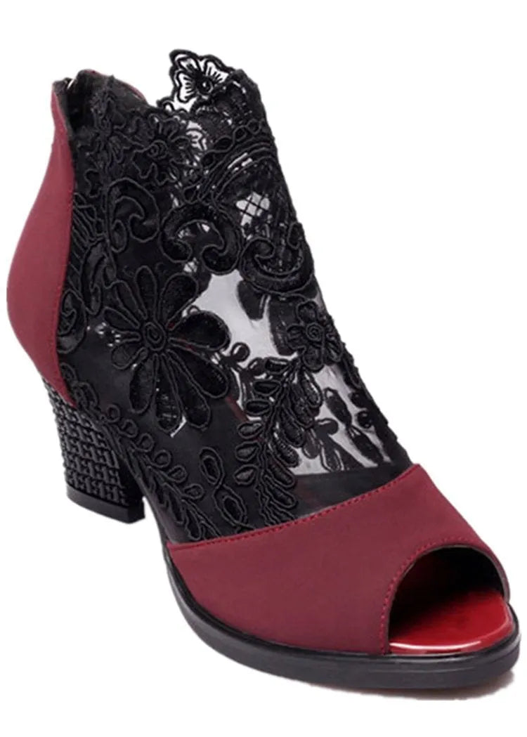 Women's black lace gladiator sandals with square heel and zip closure showing floral patterns