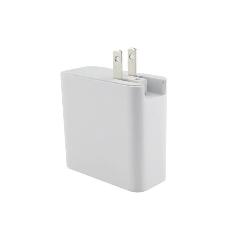 Black four-port USB-C wall charger with UK plug adapter and international travel plugs
