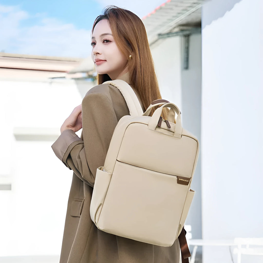 Simple canvas women's travel backpack in apricot colour with multiple compartments and sandwich pocket