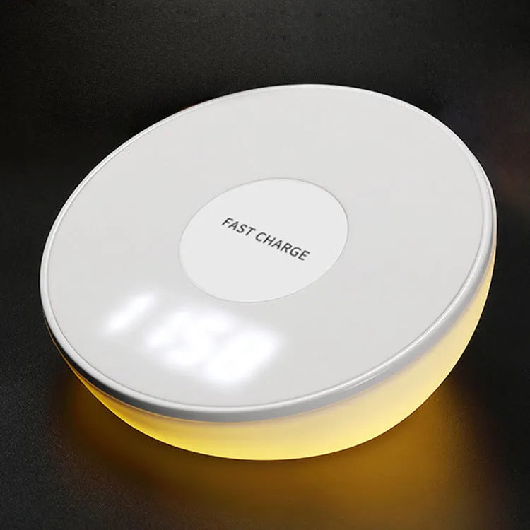 White wireless phone charger with digital clock display, three control buttons, and LED night light