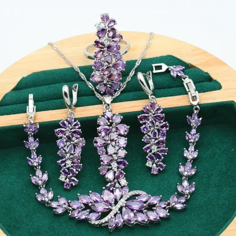 Retro botanical pattern jewellery set in copper alloy with zircon stones, showing necklace, bracelet, earrings, and ring.