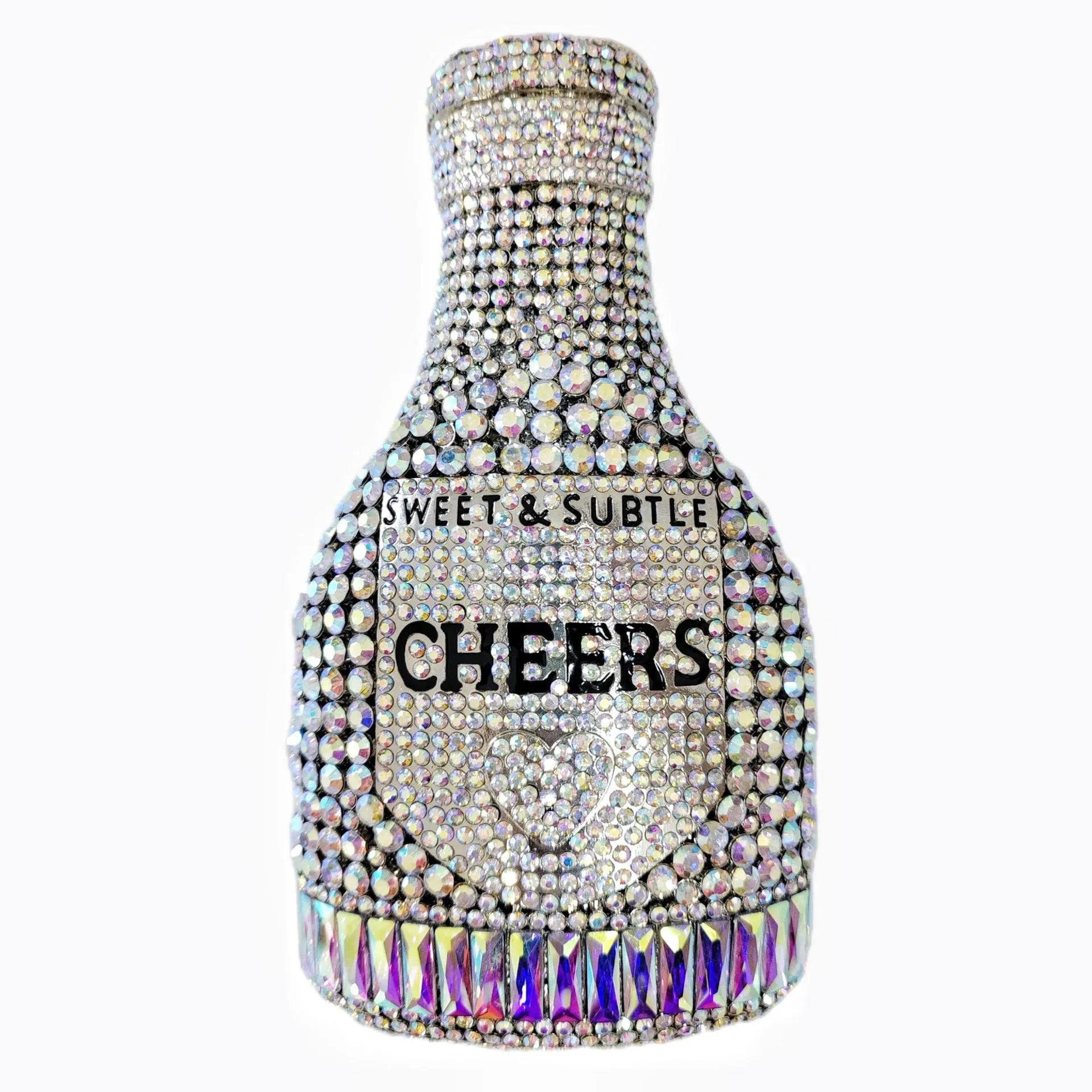 Gold hard-shell champagne bottle shaped evening clutch with rhinestones on a table.