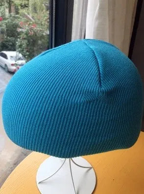 A size L decorative cover for a ski helmet, shown in one of fifteen available colour options.