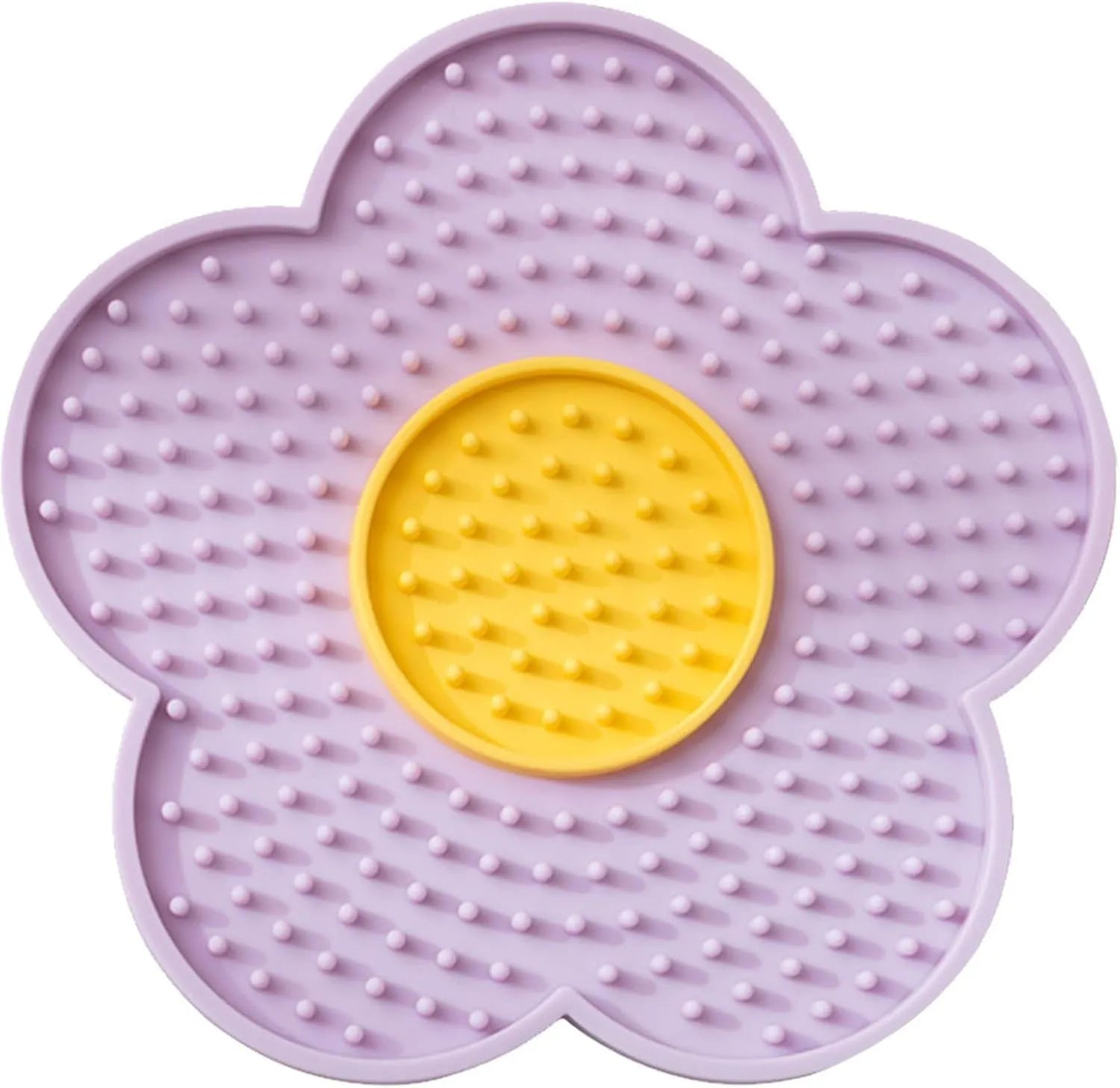 Flower-shaped blue silicone dog licking mat with suction cups on a smooth tile surface.