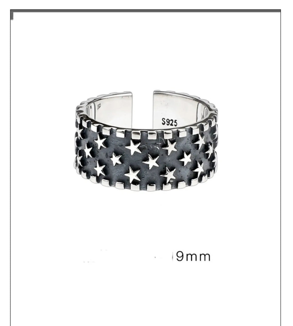 Adjustable silver ring with geometric five pointed star pattern on adjustable band