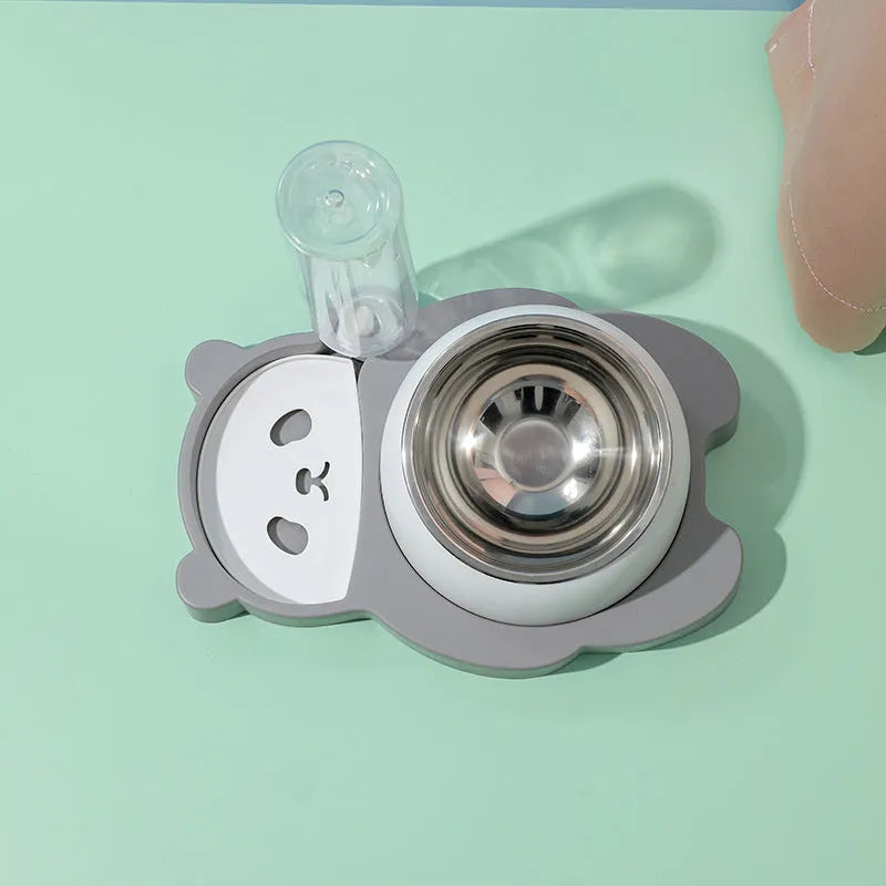 Grey panda-shaped pet feeder with tilted stainless steel bowl and automatic water bottle